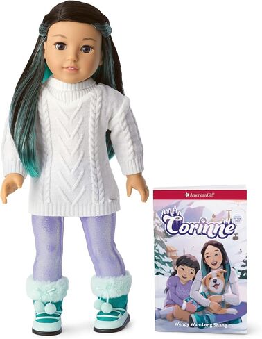 American Girl 2022 Girl of The Year Corinne 18-inch Doll & Book with Brown Eyes, Long Black Hair, Turquoise Layers, a White Cable-Knit Sweater, Iridescent Purple Leggings, and Paperback Book in Saudi Arabia
