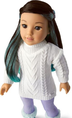 American Girl 2022 Girl of The Year Corinne 18-inch Doll & Book with Brown Eyes, Long Black Hair, Turquoise Layers, a White Cable-Knit Sweater, Iridescent Purple Leggings, and Paperback Book in Saudi Arabia
