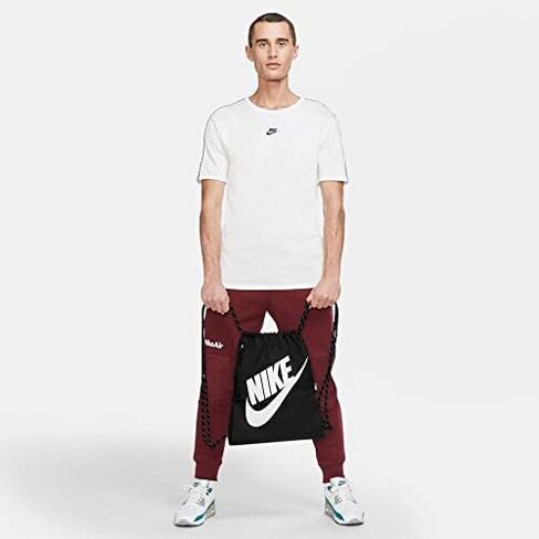 حقيبة رياضية برباط من Nike Heritage (مقاس واحد، حقيبة Nike Heritage برباط، وردي جيبسي/وردي جيبسي/برونزي معدني) in Kuwait