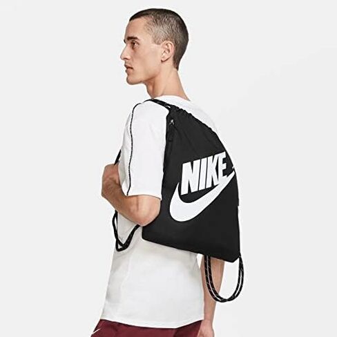 حقيبة رياضية برباط من Nike Heritage (مقاس واحد، حقيبة Nike Heritage برباط، وردي جيبسي/وردي جيبسي/برونزي معدني) in Kuwait