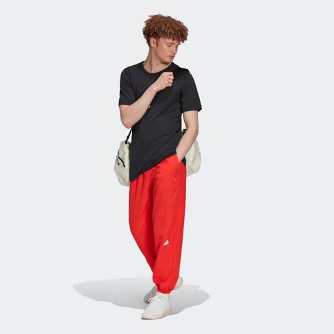بنطال منسوج Aeroready من adidas Sportswear للرجال in Saudi Arabia