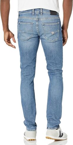 GUESS Men's Distressed Slim Fit Tapered Leg Jeans in Saudi Arabia