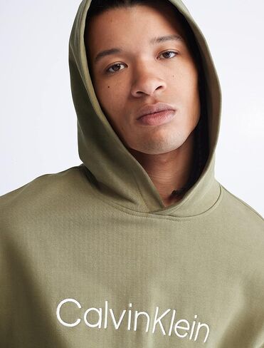 Calvin Klein Men's Relaxed Fit Logo French Terry Hoodie in Saudi Arabia