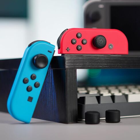 eXtremeRate 4 Pairs Black Anti-Slip Silicone Extended Length Thumb Grips Thumbstick Caps Case Cover for Nintendo Switch and Switch OLED Joy-con Controller, Joystick Cover Caps for Nintendo Switch Lite in Saudi Arabia