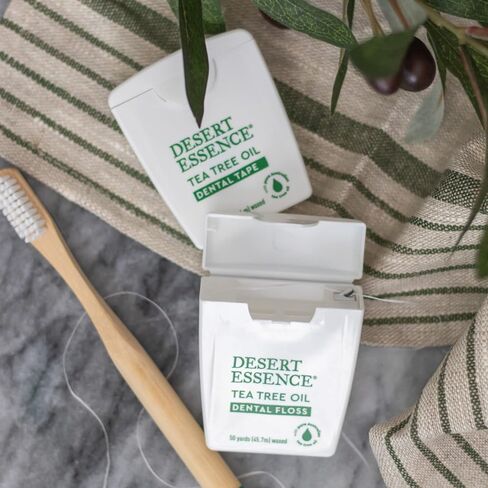 شريط أسنان بزيت شجرة الشاي من Desert Essence - 30 ياردة - عبوة من 6 قطع - مشمع طبيعي مع شمع العسل - خيط تنظيف سميك بدون شريط تمزيق - أثناء التنقل - يزيل تراكم بقايا الطعام - مطهر لم يتم الإساءة إلى الحيوانات لتصنيعه in Kuwait