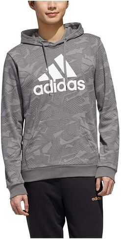 adidas male essentials all over print hoodie in Saudi Arabia