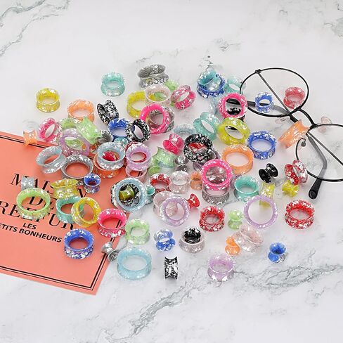 24 قطعة من Qmcandy ملمع سيليكون ملون متناثر مع بقع الأذن ومقاييس أنفاق اللحم ومقابس مزدوجة متوهجة ومجوهرات ثقب الأذن in Kuwait