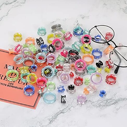 24 قطعة من Qmcandy ملمع سيليكون ملون متناثر مع بقع الأذن ومقاييس أنفاق اللحم ومقابس مزدوجة متوهجة ومجوهرات ثقب الأذن in Kuwait