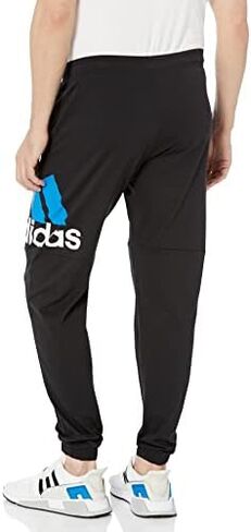 adidas Men's Essentials Performance Logo Pants in Saudi Arabia
