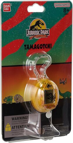 الذكرى السنوية الثلاثين لـ Tamagotchi Nano x Jurassic Park - إصدار Dinosaur Amber. in Kuwait