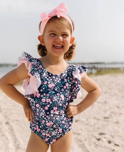 RuffleButts Baby/Toddler Girls Ruffle Strap - One Piece Swimsuit UPF 50+ | 80% Nylon 20% Spandex, High Stretch Fabric, Lightweight Feel, Cross-Back Design, Floral Botanical Print, Adjustable Fit in Saudi Arabia
