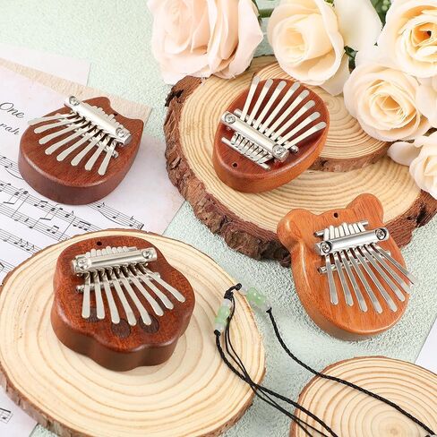 Boao 24 قطعة كاليمبا الصغيرة 8 مفاتيح رائعة إصبع الإبهام البيانو لطيف إصبع البيانو مع الحبل الملحقات البيانو الصغيرة للأطفال البالغين المبتدئين عشاق الموسيقى اللاعبين قلادة هدية، ملفوفة بشكل فردي in Kuwait