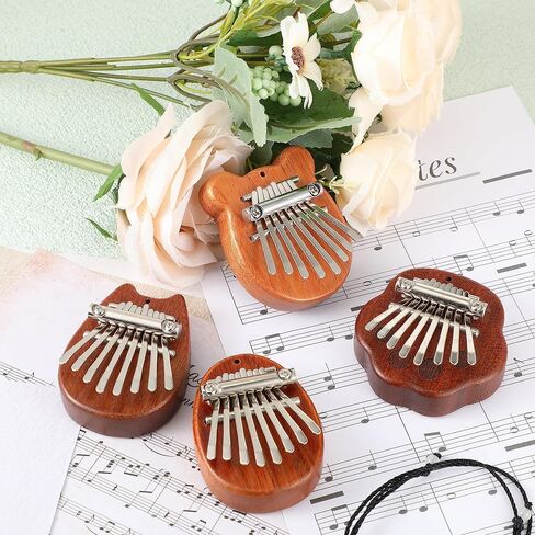 Boao 24 قطعة كاليمبا الصغيرة 8 مفاتيح رائعة إصبع الإبهام البيانو لطيف إصبع البيانو مع الحبل الملحقات البيانو الصغيرة للأطفال البالغين المبتدئين عشاق الموسيقى اللاعبين قلادة هدية، ملفوفة بشكل فردي in Kuwait