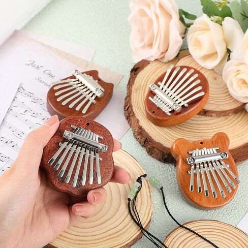 Boao 24 قطعة كاليمبا الصغيرة 8 مفاتيح رائعة إصبع الإبهام البيانو لطيف إصبع البيانو مع الحبل الملحقات البيانو الصغيرة للأطفال البالغين المبتدئين عشاق الموسيقى اللاعبين قلادة هدية، ملفوفة بشكل فردي in Kuwait