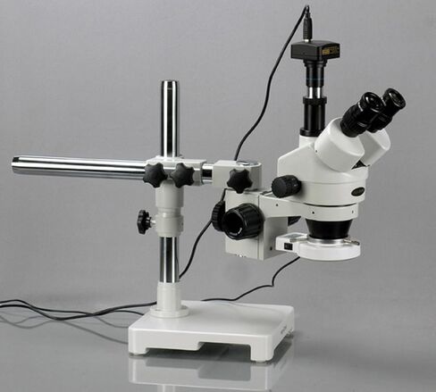 AmScope SM-3TX-54S-M Digital Professional Trinocular Stereo Zoom Microscope, WH10x Eyepieces, 3.5X-45X Magnification, 0.7X-4.5X Zoom Objective, 54-Bulb LED Light, Single-Arm Boom Stand, 110V-240V, Includes 0.5X Barlow Lens and 1.3MP Camera with Reduction  in Kuwait