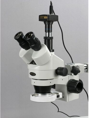 AmScope SM-3TX-54S-M Digital Professional Trinocular Stereo Zoom Microscope, WH10x Eyepieces, 3.5X-45X Magnification, 0.7X-4.5X Zoom Objective, 54-Bulb LED Light, Single-Arm Boom Stand, 110V-240V, Includes 0.5X Barlow Lens and 1.3MP Camera with Reduction  in Kuwait