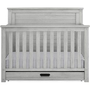 Delta Children Simmons Kids Caden 6-in-1 Convertible Crib with Trundle Drawer, Greenguard Gold Certified, Aged Oak in Kuwait