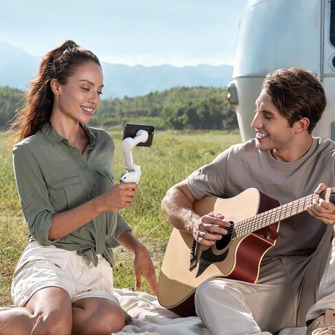 DJI OM 4 - مثبت جيمبال للهواتف الذكية ثلاثي المحاور مع قبضة وحامل ثلاثي القوائم ومثبت جيمبال مثالي لمدونات الفيديو واليوتيوب والفيديو المباشر ومثبت الهاتف المتوافق مع iPhone وAndroid in Kuwait