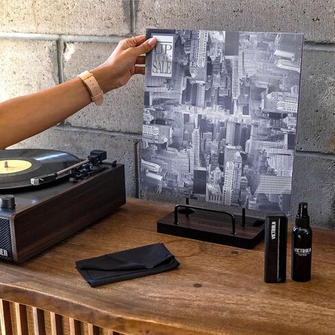 Victrola 'The Kit' - مجموعة تنظيف أسطوانات الفينيل، يمكن استخدامها كحامل تسجيل، وتتضمن فرشاة مضادة للكهرباء الساكنة، ومحلول تنظيف، وقماش، وحامل بلمسة نهائية من خشب الإسبريسو مع لمسات معدنية سوداء ذكية in Kuwait