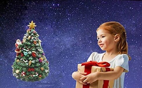 شجرة عيد الميلاد مع تيدي بير من لايت آدر، هدايا وموسيقى عيد الميلاد تلعب في مادة البولي الراتنج in Kuwait