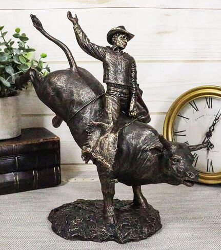 Ebros Rustic Western Rodeo Bull Rider Cowboy On Bucking Bull Statue 10.5" Tall Faux Bronze Resin Old World Wild West Cattle Bull Riding Cowboys Themed Accent Figurine in Saudi Arabia