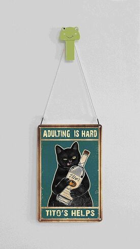 لافتة عتيقة من القصدير بعبارة "Adult Is Hard Tito's Assists" لديكور الحائط بتصميم قطة سوداء مضحكة مقاس 8 × 12 انش (921) in Kuwait