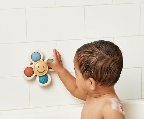 Itzy Ritzy Fidget Toy with Sensory Poppers & Suction Cup; Fidget Toy Sticks to Highchairs, Tables or Tubs While Spinning & Engaging Baby with 4 Textured Poppers, Smile in Saudi Arabia
