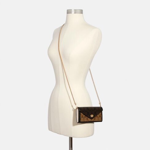 Coach Signature Blocking Envelope Wallet w Chain and Turnlock in Saudi Arabia