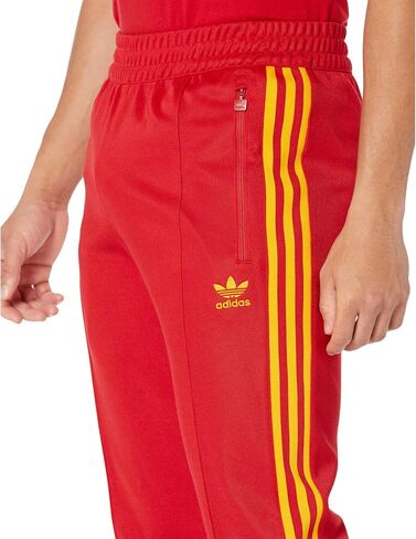 بنطال رياضي Beckenbauer من adidas Originals، Team Power Red/Team Collegiate Gold SM in Saudi Arabia