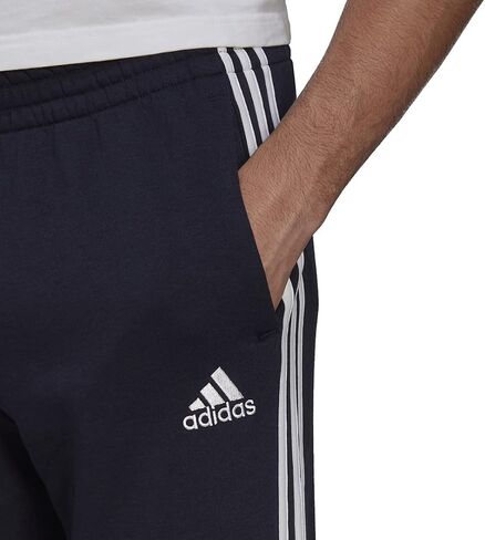 adidas Men's Essentials Fleece Open Hem 3-Stripes Pants, Legend Ink, Medium in Saudi Arabia