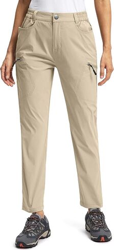 سروال Pudolla النسائي للتنزه سيرًا على الأقدام مع 6 جيوب، سروال سفر قابل للتمدد مقاوم للماء للنساء للعمل في الهواء الطلق ومشي الجولف in Kuwait