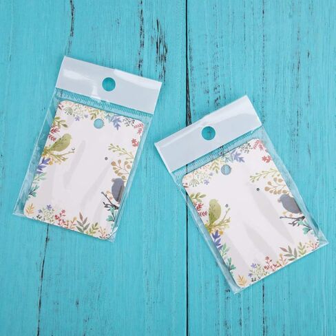 مجموعة بطاقات القرط، 100 قطعة من بطاقات عرض القرط الورقية مع 100 قطعة من أكياس الغلق الذاتي، علامات تنظيم حامل البطاقات الملونة الأنيقة DIY بطاقات التعبئة اليدوية لقلادة القرط (مرصعة بالنجوم) in Kuwait