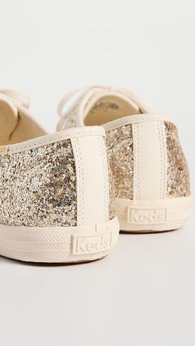 أحذية رياضية للسيدات من Keds Champion Glitter Celebrations، ذهبي، 7 متوسط ​​أمريكي in Saudi Arabia