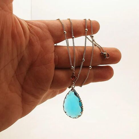 مجموعة أقراط وقلادة من Howls Green Water في مجوهرات Howls Moving Castle - الرسوم المتحركة اليابانية المفضلة المستخدمة كإكسسوارات تنكرية أو هدايا مجوهرات للحفلات التنكرية والنساء والرجال ومحبي الرسوم المتحركة. in Kuwait