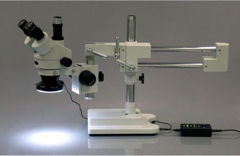AmScope SM-4TX-144A مجهر ستيريو ثلاثي العينيات، عدسات WF10x، تكبير 3.5X-45X، قوة موضوعية 0.7X-4.5X، عدسة بارلو 0.5X، مصدر ضوء LED على شكل حلقة 144 لمبة، حامل ذراع مزدوج، 110- 240 فولت، أبيض in Saudi Arabia