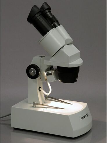 AmScope SE305-AX مجهر ستيريو ثنائي العينين، عدسات WF5x وWF10x، تكبير 5X/10X/15X/30X، أهداف 1X و3X، إضاءة هالوجين علوية وسفلية، لوحة مسرح سوداء/بيضاء قابلة للعكس، حامل ذراع، 120 فولت in Saudi Arabia