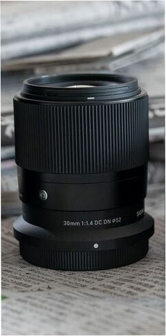 Sigma 30mm F1.4 DC DN Contemporary Lens for Nikon Z Mount Mirrorless Camera with LH586-01 Lens Hood (Black) Bundle with Sling Camera Bag, 64 GB SDXC Memory Card, Cleaning and Accessory Kit (4 Items) in Saudi Arabia