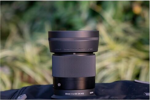 Sigma 30mm F1.4 DC DN Contemporary Lens for Nikon Z Mount Mirrorless Camera with LH586-01 Lens Hood (Black) Bundle with Sling Camera Bag, 64 GB SDXC Memory Card, Cleaning and Accessory Kit (4 Items) in Saudi Arabia