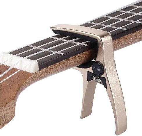 Mini Size Professional 4 String Guitar Capo, Ukulele Capo (GOLD) in Saudi Arabia