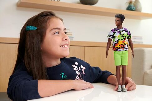 Barbie Ken Fashionistas Doll, Broad, Black Curly Hair, Multi-Colored Camo Print Shirt, Neon Green Shorts, Silvery Sneakers, Toy for Kids 3 to 8 Years Old in Saudi Arabia