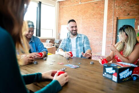 USAOPOLY What The Cup!? | Social Bluffing Dice Game | Featuring Handheld Dice Cups & D12 Dice | Spy, Swap, Steal The Winning Cup | 3-6 Players, Ages 12+ in Saudi Arabia