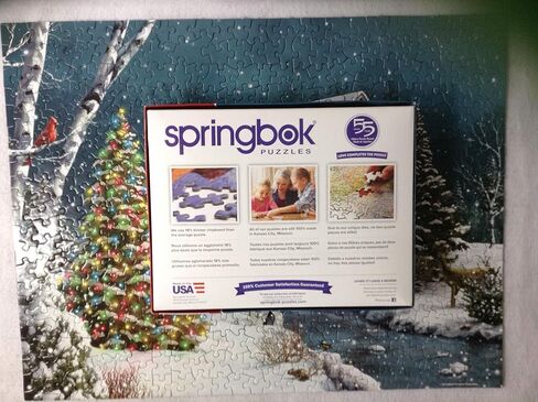 Springbok The Falling Snow 500 Piece Jigsaw Puzzle for Adults Features a Holiday Cabin Glowing in The Snow with a Decorated Christmas Tree Beside it in Saudi Arabia