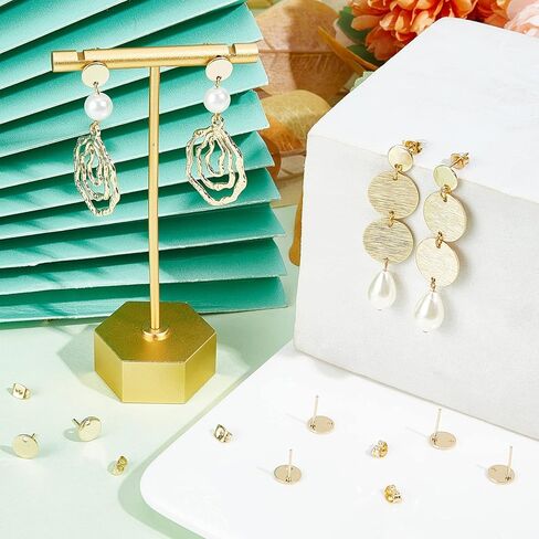 Beebeecraft 1 صندوق 50 زوجًا من أقراط الأذن المستديرة المسطحة 24 قيراط مطلية بالذهب من الفولاذ المقاوم للصدأ مكونات الأذن مع صواميل الأذن للنساء لصنع المجوهرات in Kuwait