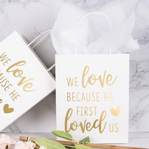 WRAPAHOLIC Medium Size Gift Bags - Gold Foil We Love Because He First Loved Us White Paper Bags with Handles for the Lovers of Scriptures and Christians - 12 Pack - 8" x 4" x 10" in Saudi Arabia
