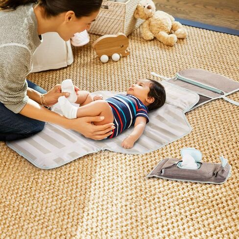 Munchkin Portable Changing Pad – Lightweight and Compact Baby Diaper Changing Mat with Silver-Ion Technology, Includes 12 Diaper Disposal Bags, Grey in Saudi Arabia