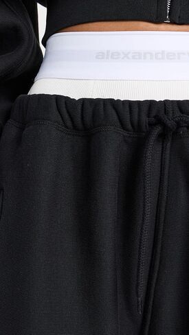 بنطال رياضي نسائي واسع الساق من Alexander Wang مع سراويل داخلية مرنة مكشوفة تحمل الشعار in Kuwait
