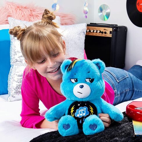 Care Bears - 14" Rock Theme Cheer Bear - Medium Size Plush - Soft, Huggable Plushie, Stuffed Animal for Girls and Boys, Ages 4+ in Saudi Arabia