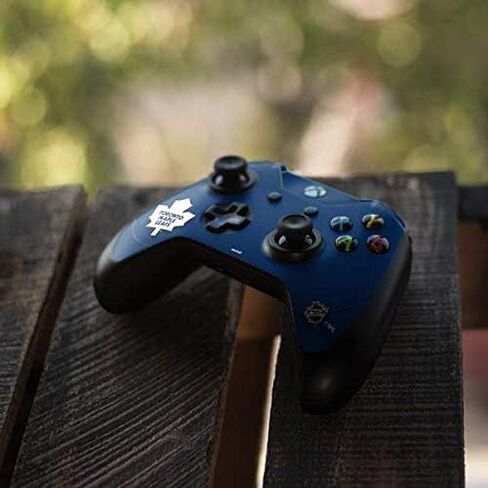 Skinit Decal Gaming Skin Compatible with Xbox One Elite Controller - Officially Licensed NHL Toronto Maple Leafs Solid Background Design in Saudi Arabia