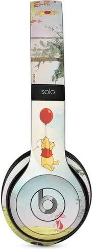 غلاف صوتي من Skinit متوافق مع Beats Solo 2 سلكي - تصميم Disney Winnie The Pooh Red Ballon المرخص رسميًا in Saudi Arabia