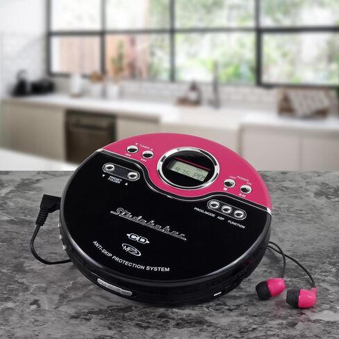 مشغل الأقراص المضغوطة المحمول Studebaker Pink Retro | تشغيل أقراص CD-R/RW MP3 | مشغل أقراص مضغوطة شخصي قابل للبرمجة | مكافحة التخطي | راديو اف ام | تعزيز ميجا باس | سماعات أذن رياضية (أرجواني عتيق) in Kuwait